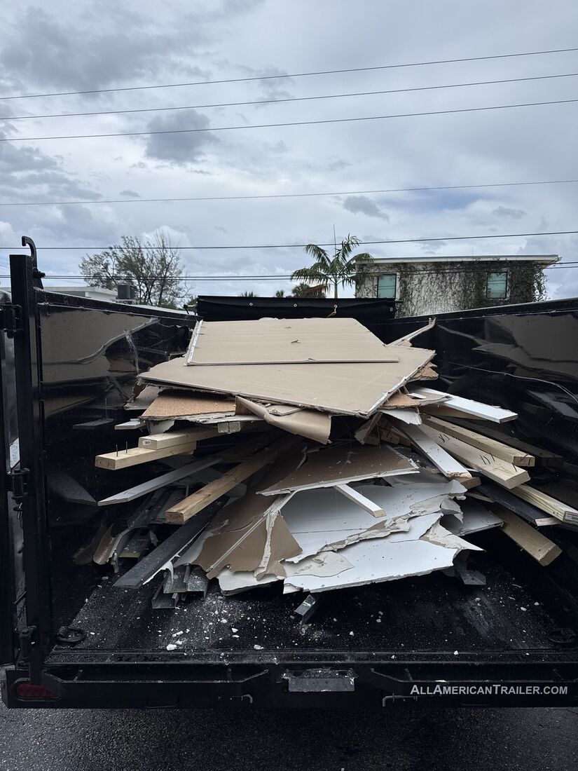 Trailer loaded with drywall and lumber